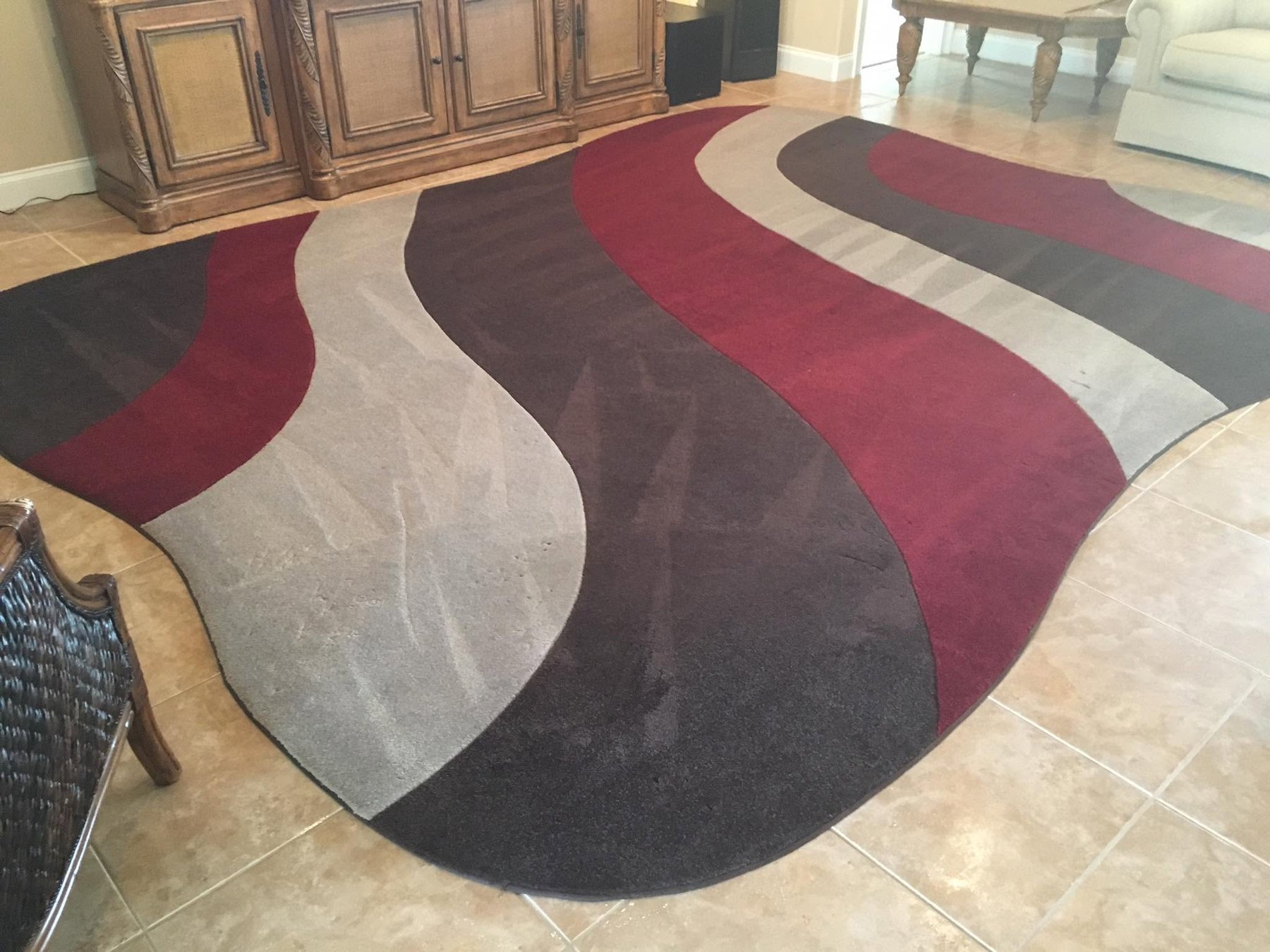 Colorful wave-pattern area rug freshly cleaned in a New Smyrna Beach home