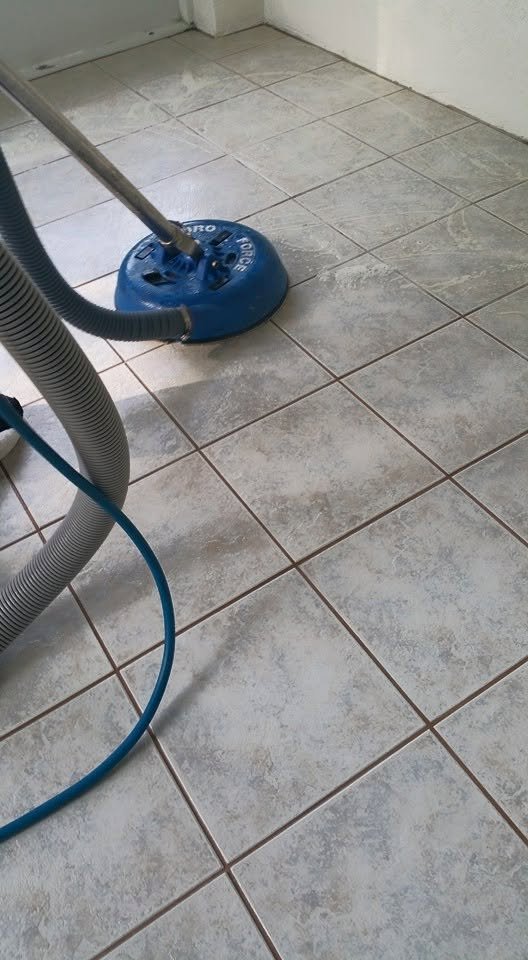 Tile floor cleaned with rotary extraction tool
