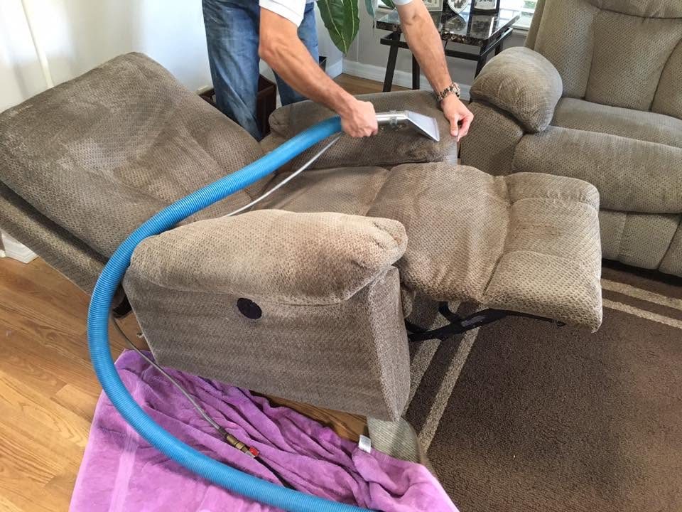 Upholstered furniture cleaning in progress